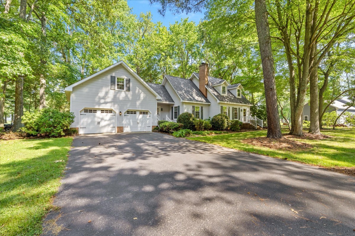 Full exterior with two-car garage and driveway